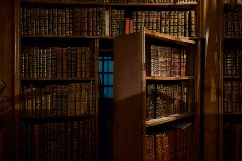 A vintage library with a hidden bookshelf door