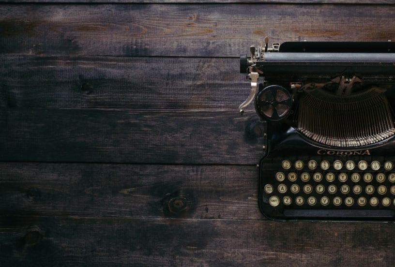 A vintage typewriter on a wooden table