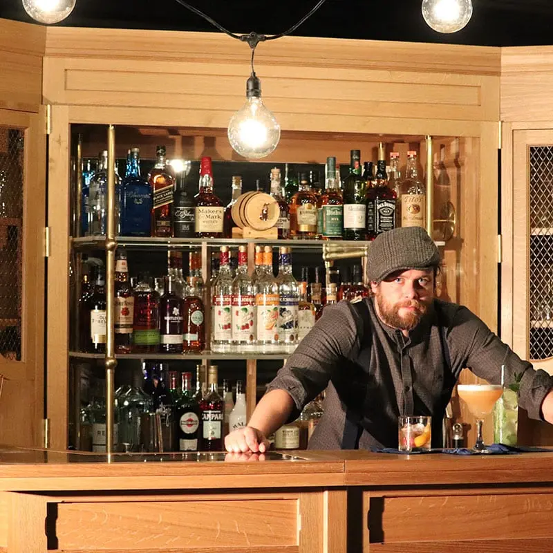 Bartender behind the bar